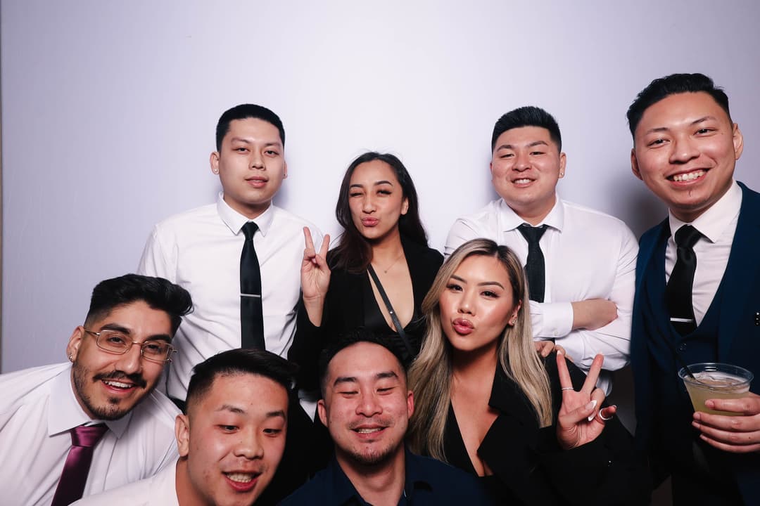 Creative photo booth session with multiple guests