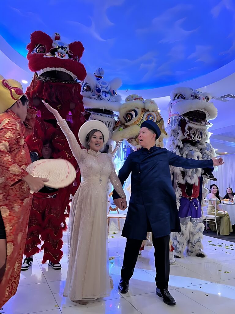 Bride and groom with lion dancing